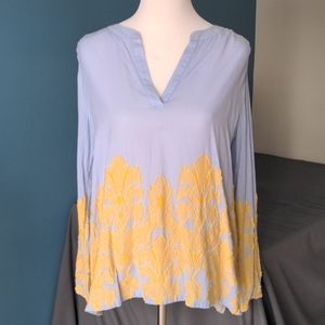 Loft soft blue blouse with yellow floral accents.